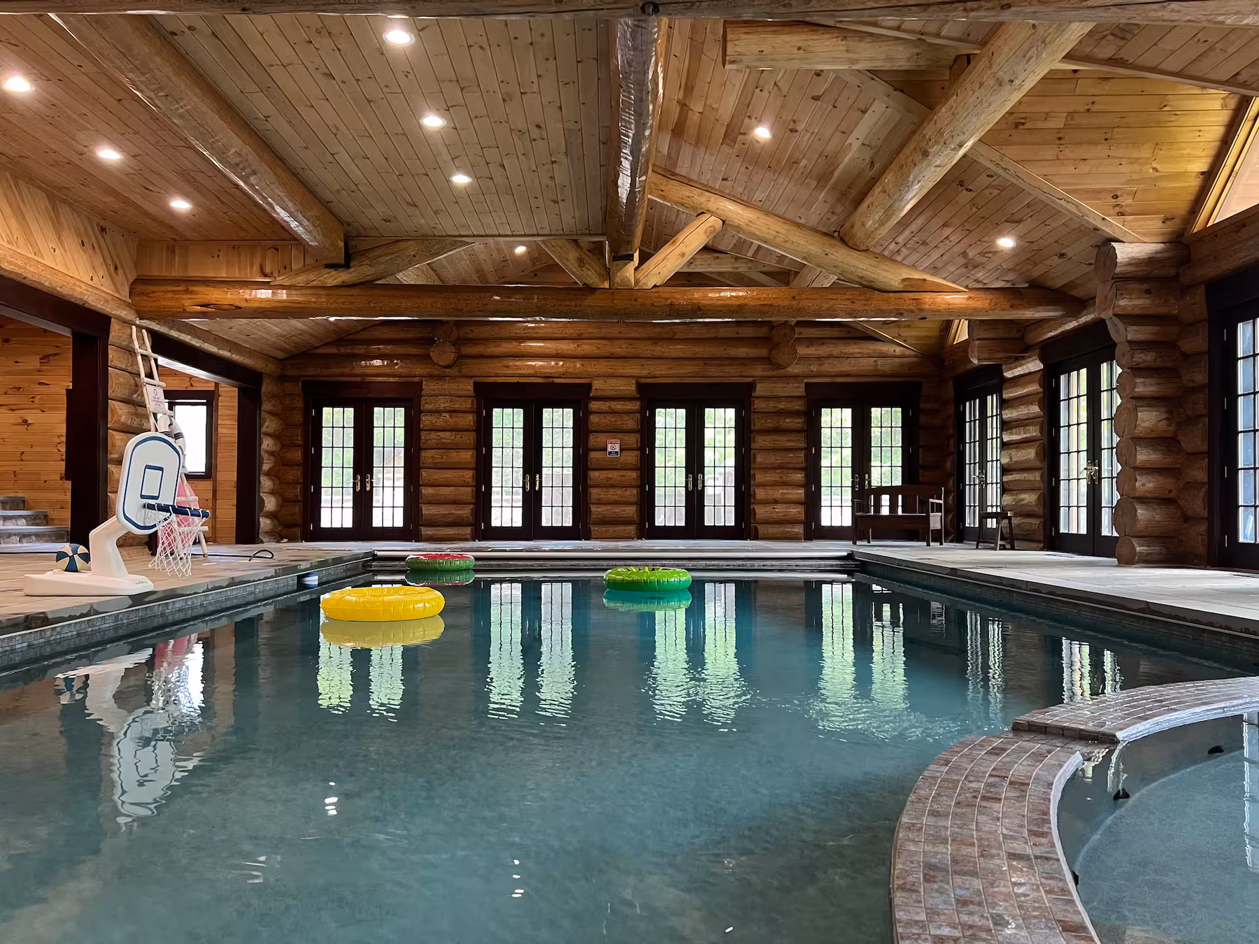 Indoor pool inside the log cabin